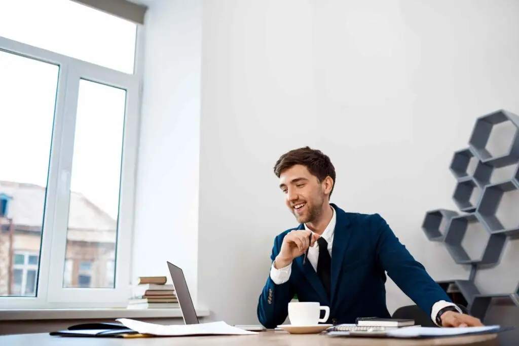 Young entrepreneur working confidently in office